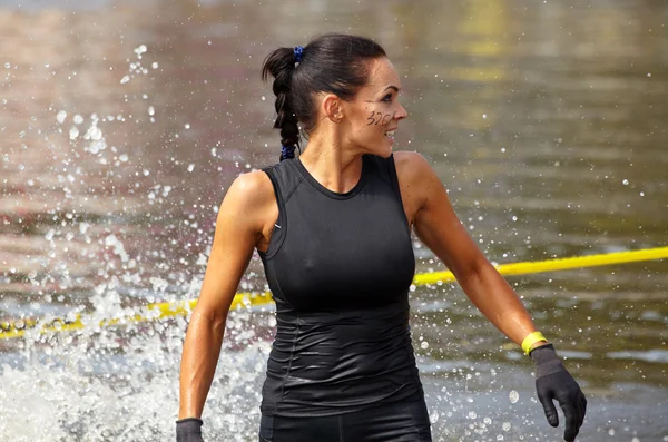 Wet sporty woman in lake