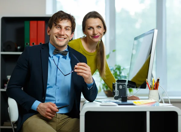 Young colleague - man and woman working from home - modern busin