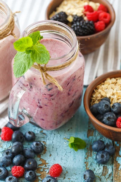 Well being and weight loss concept, berry smoothie and oatmeal w