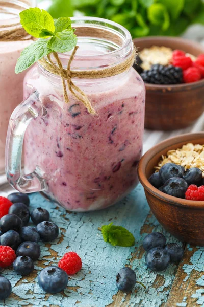 Well being and weight loss concept, berry smoothie and oatmeal w