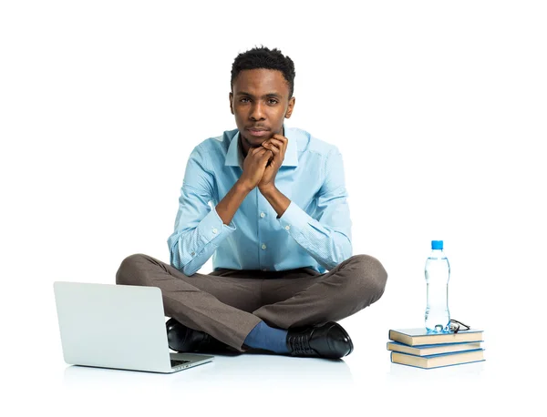 African american college student with laptop, books and bottle o