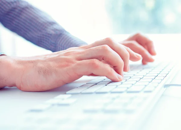 Male hands or men office worker typing on the keyboard