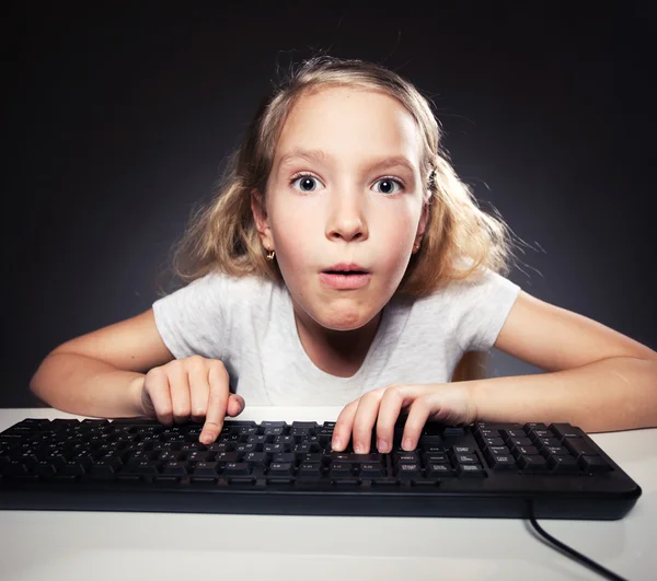Child looking at a computer