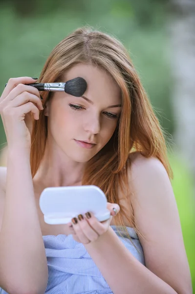 Young woman with bare shoulders eyes colors