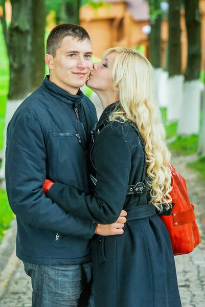 Woman kissing her boyfriend