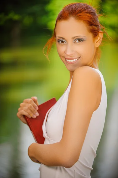 Portrait of beautiful red-haired student