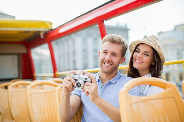 Young couple in a tourist bus