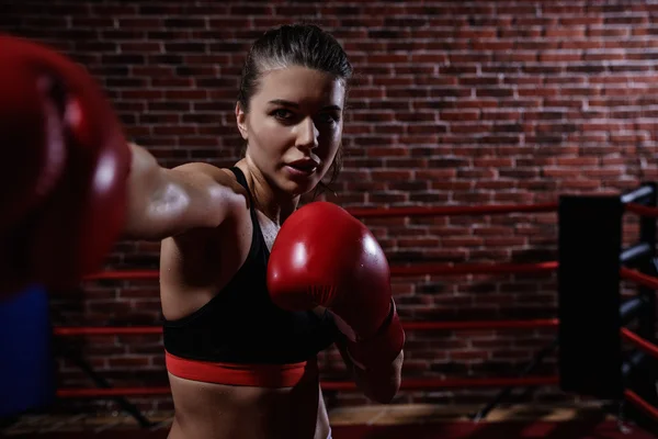 Sports woman in boxing gloves