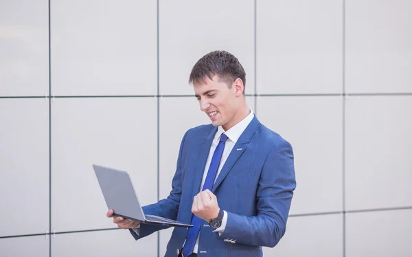 Young business man think look up hold tablet pc computer