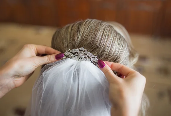 Bride getting ready for wedding in hair