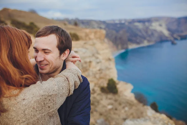 Couple in love relaxing, mountain Coast