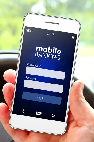 Hand holding mobile phone with banking log in page