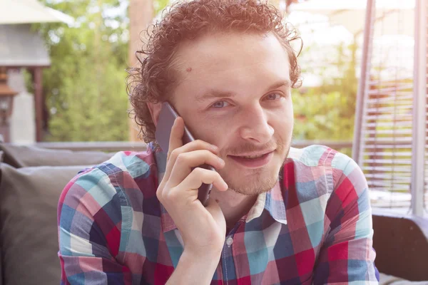 Handsome young buisnessman talk on phone. Happy hipster with phone