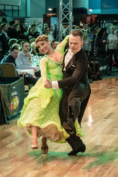 Competitors dancing slow waltz or tango