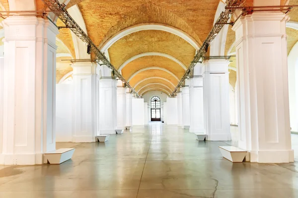 Big marble corridor with white columns