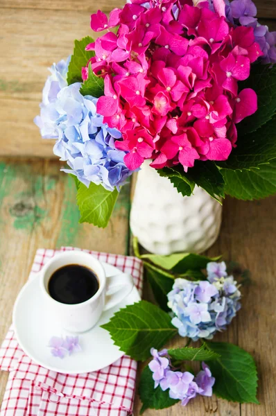 Hydrangea flowers and coffee