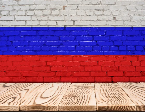 Russia flag painted on brick wall with wooden floor