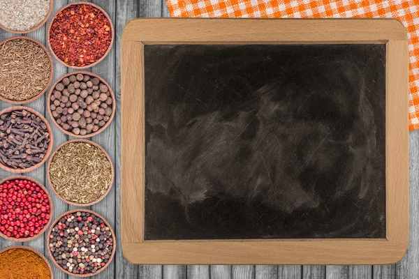Spices and Vintage blackboard with copyspace. Food background
