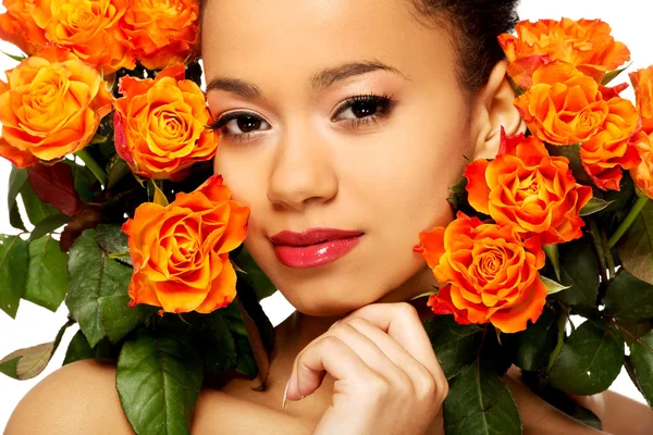 Beauty african woman with roses.