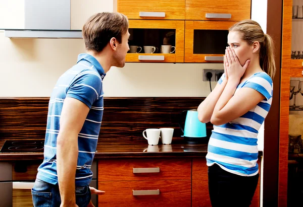 Young couple having quarrel in the kitchen