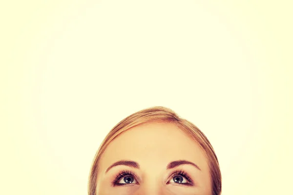 Young woman eyes looking up