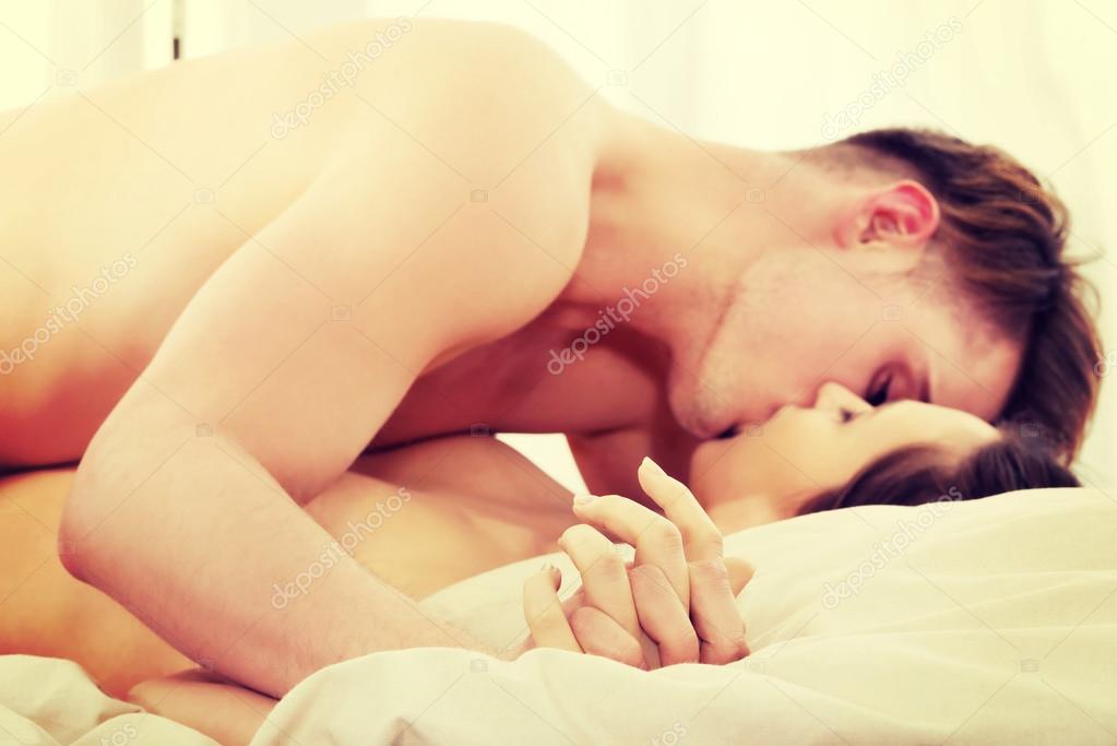 Couple kissing bed