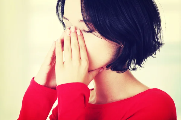 Woman with sinus pressure pain