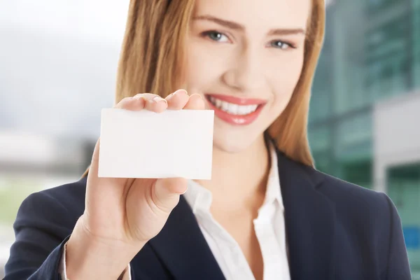 Beautiful caucasian woman holding small personal card.