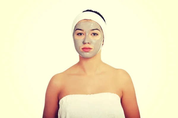 Relaxed woman with a nourishing face mask