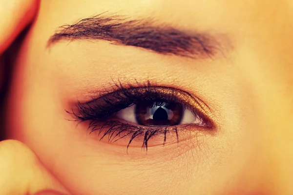 Woman eye with long eyelashes.