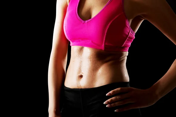 Athletic young woman on the gym