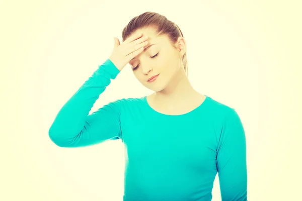 Teen woman with headache.