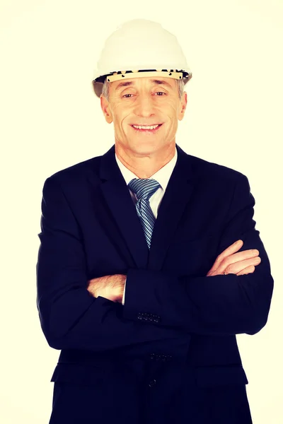 Smiling businessman with hard hat