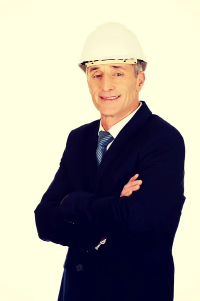 Smiling businessman with hard hat