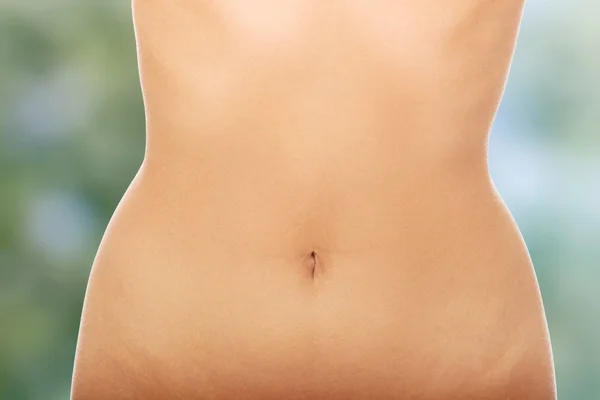 Womans slim belly.