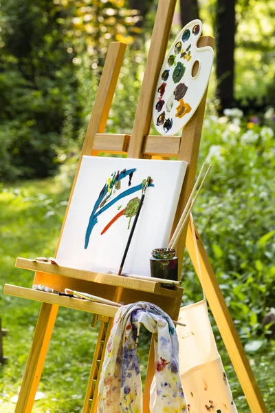 Easel with canvas in a garden