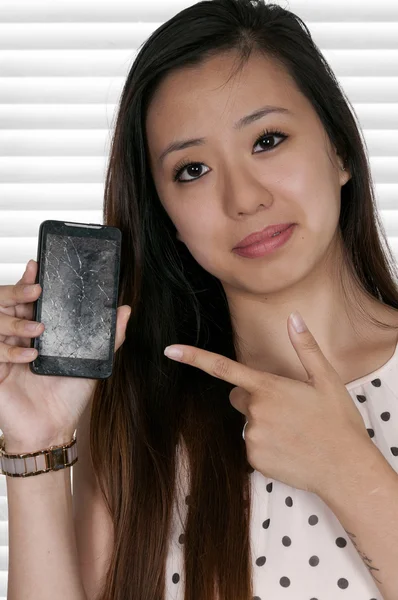 Woman with cracked phone screen