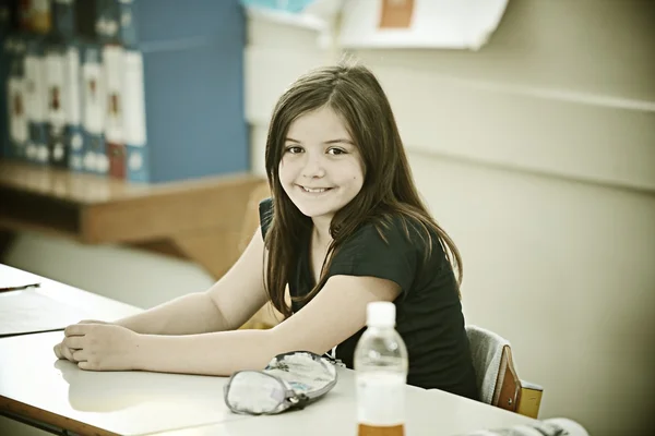 Kid at school room having education activity