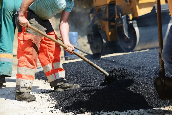 Hard work on asphalt construction