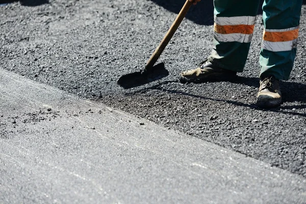 Hard work on asphalt construction