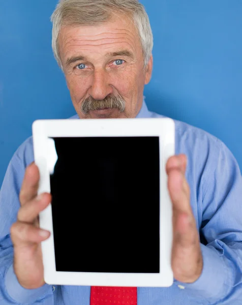 Senior businessman holding tablet