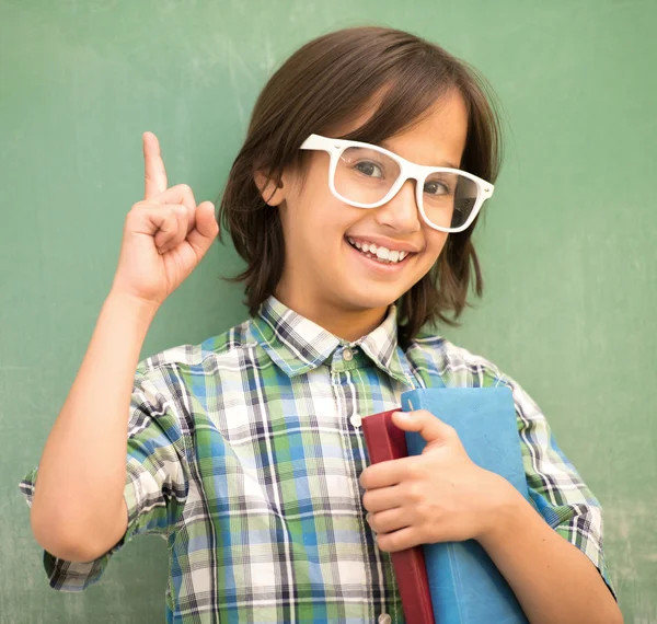 Happy school boy posing