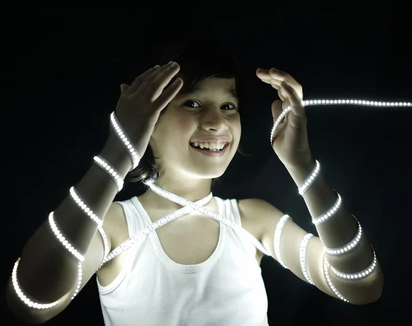 Portrait of kid with led strip light