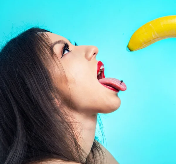 Hot asian woman eating banana