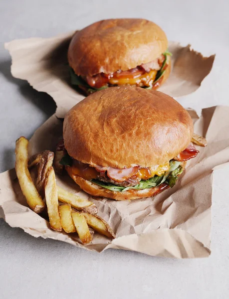Delicious burgers with french fries