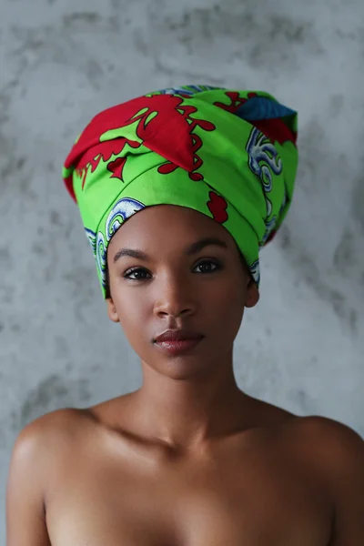 Woman in green head wrap