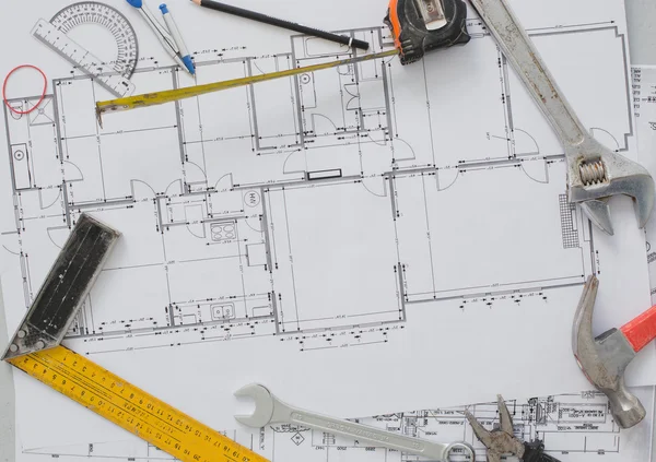 Tools and drawings on table