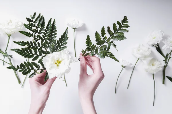 Woman making a flower bouquet