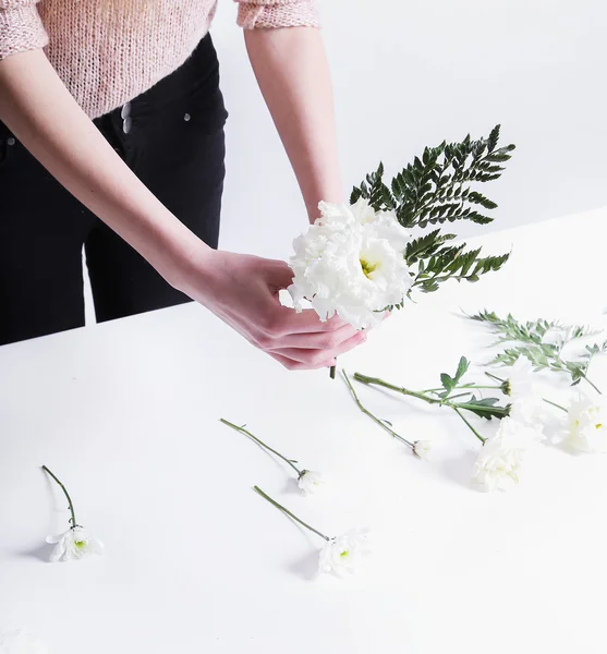 Woman making a flower bouquet