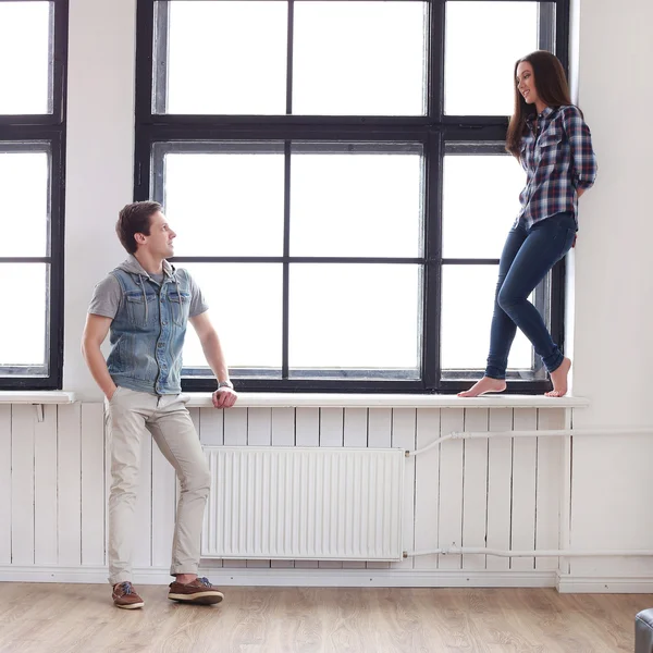 Beautiful couple by the window